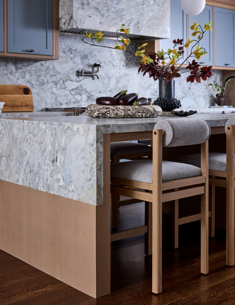Close-up of luxury kitchen island with floral centerpiece in Mill Valley custom home by S.A. Baxter, Inc.