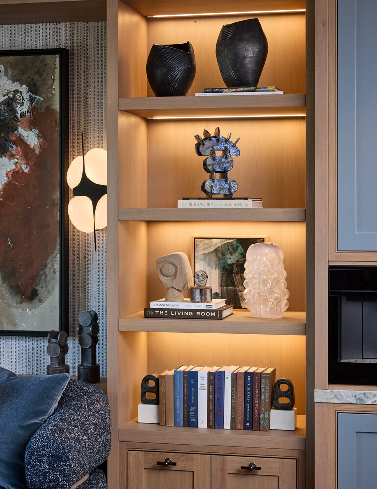 Curated shelf decor with sculptural art and modern lighting in Los Altos custom home by S.A. Baxter, Inc.