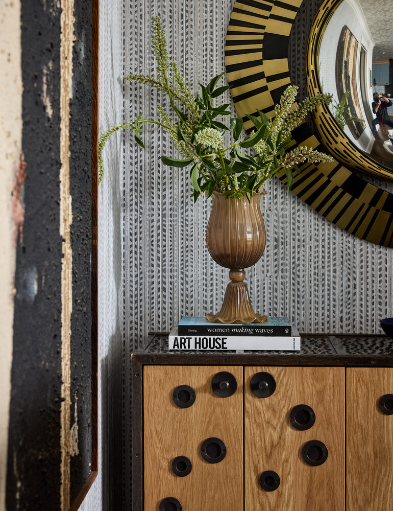Decor styling detail with floral vase and art books in San Francisco custom home by S.A. Baxter, Inc.