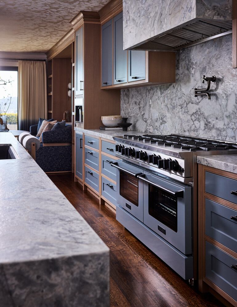 Gourmet kitchen featuring a double oven and stone finishes in San Francisco home by S.A. Baxter, Inc.