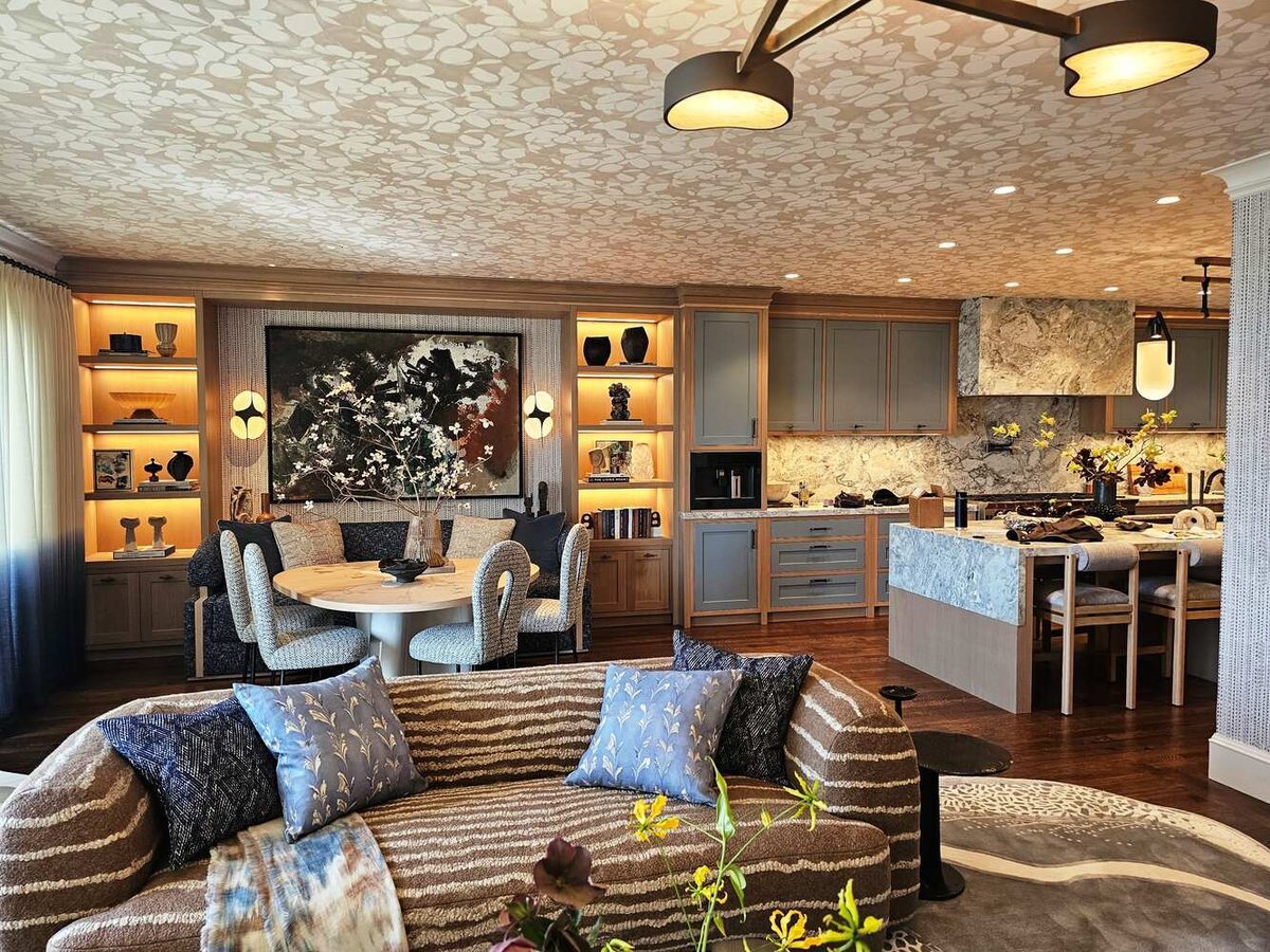 Open kitchen and dining area with marble accents in a Hillsborough custom home by S.A. Baxter, Inc.