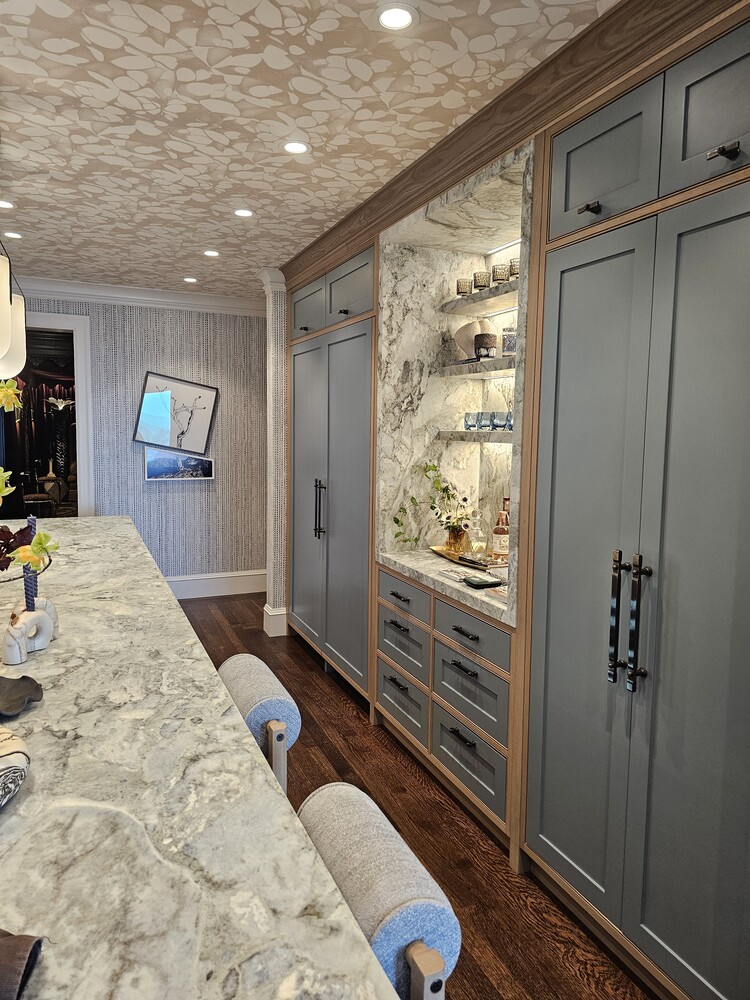 Sleek and spacious kitchen storage solution with hidden fridge panels in Los Altos by S.A. Baxter, Inc.