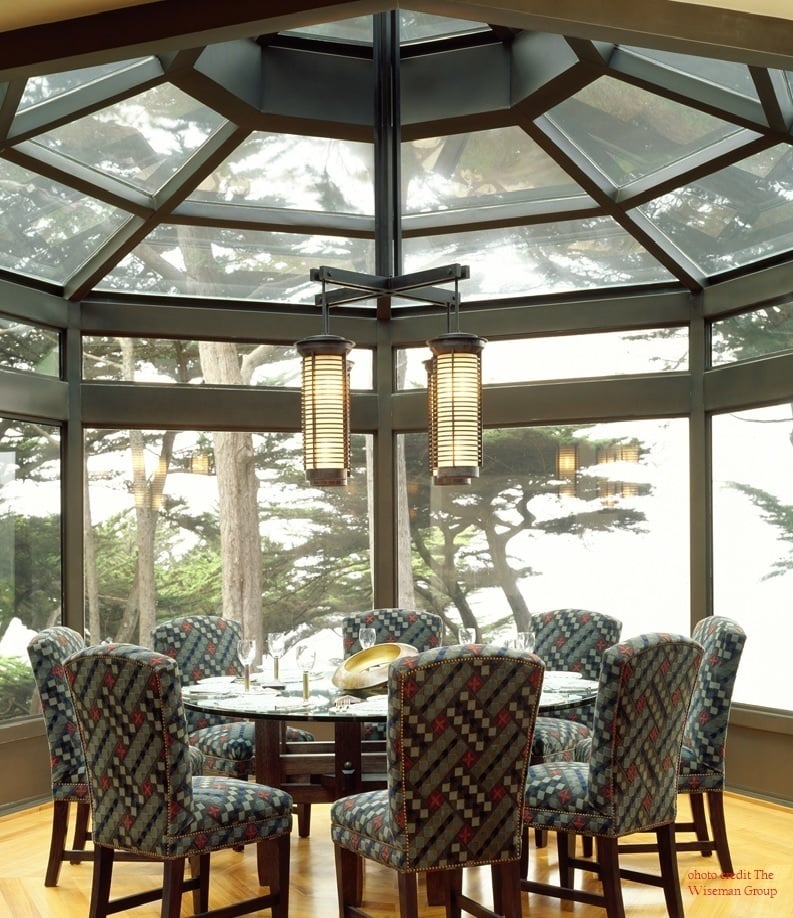 Elegant dining area with custom patterned chairs and pendant lighting by S.A. Baxter, Inc. in Carmel Highlands, CA.