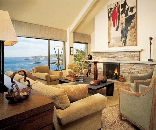 Living room with expansive ocean views and modern fireplace design by S.A. Baxter, Inc. in Carmel Highlands, CA.