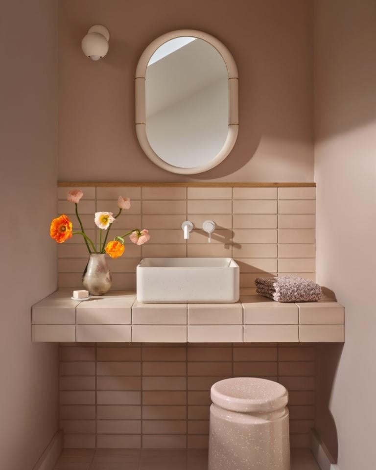 Contemporary pink bathroom vanity with vessel sink and floral decor in a Marin County custom home remodel by S.A. Baxter, Inc.