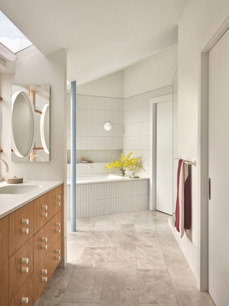 Minimalist bathroom with wood cabinetry and soaking tub in a Marin County custom home by S.A. Baxter, Inc.