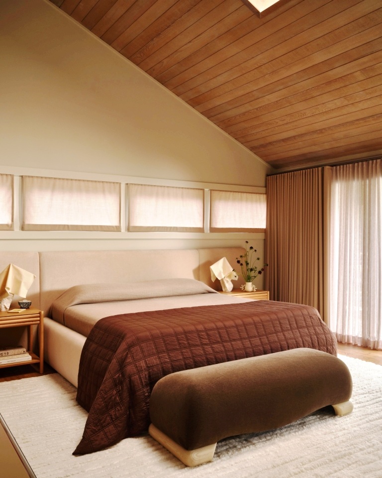 Neutral-toned primary bedroom with soft lighting and warm textures by S.A. Baxter, Inc. in Marin County, CA