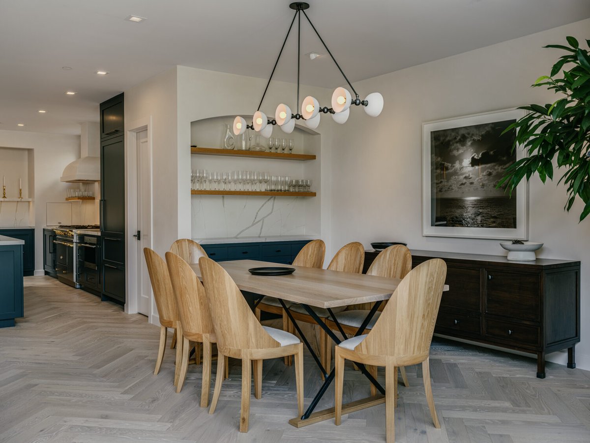 Full view of custom kitchen and dining area with blue cabinetry by S.A. Baxter, Inc. in Marina District, CA