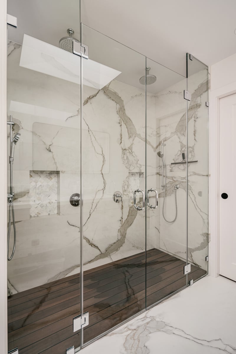 Luxury walk-in shower with marble walls and glass enclosure by S.A. Baxter, Inc., Marina District, CA
