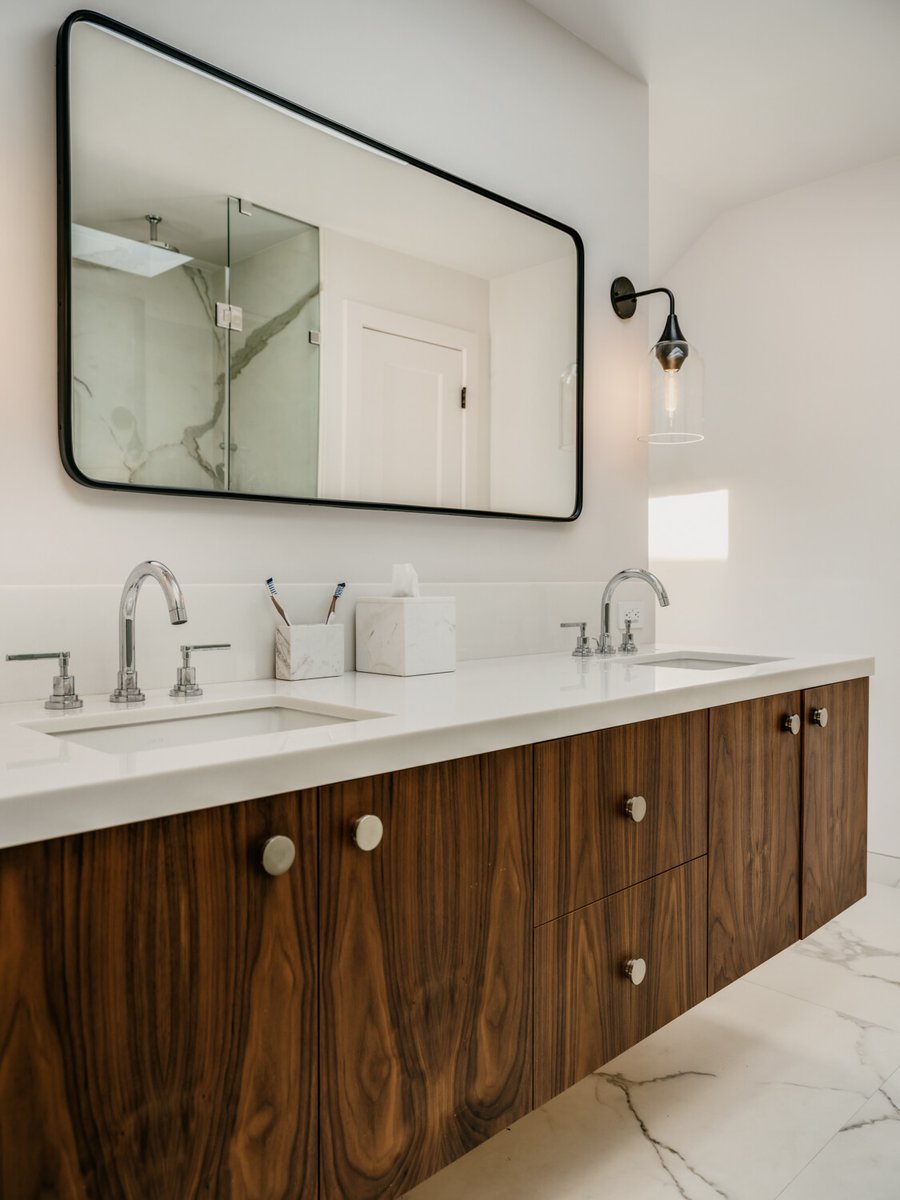 Modern bathroom with double vanity and walnut cabinetry by S.A. Baxter, Inc. in Marina District custom home