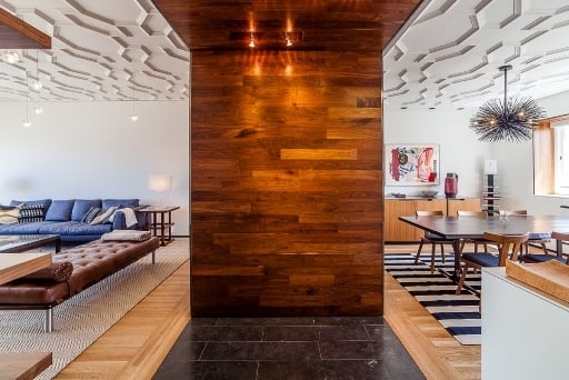 Central wood-paneled column dividing living and dining space in custom Nob Hill home by S.A. Baxter, Inc.