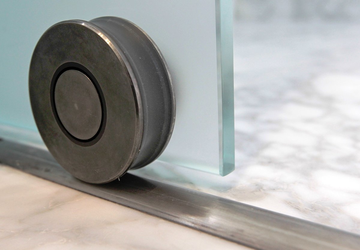 Close-up of glass door hardware in custom Nob Hill, CA home by S.A. Baxter, Inc.