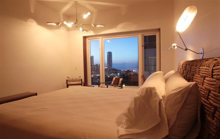 Evening view from custom bedroom with skyline backdrop in Nob Hill, CA by S.A. Baxter, Inc.