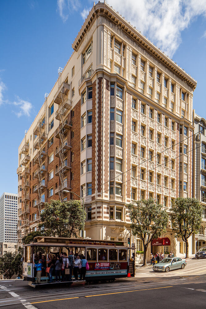 Historic exterior of 850 Powell Street with cable car in Nob Hill, CA, home to S.A. Baxter, Inc. project.