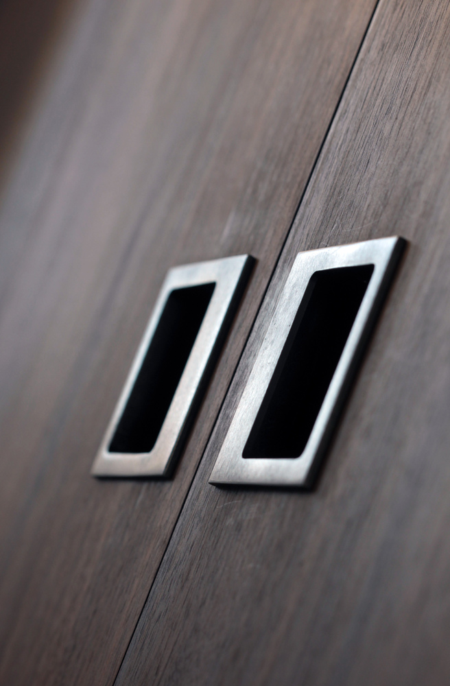 Modern inset cabinet pulls on wood paneling in Nob Hill custom home by S.A. Baxter, Inc.