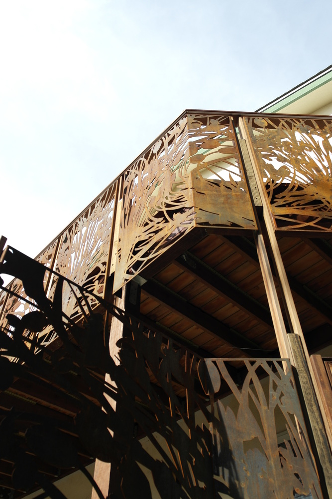 Angled perspective of detailed metal balcony railing in Palo Alto custom home by S.A. Baxter, Inc.