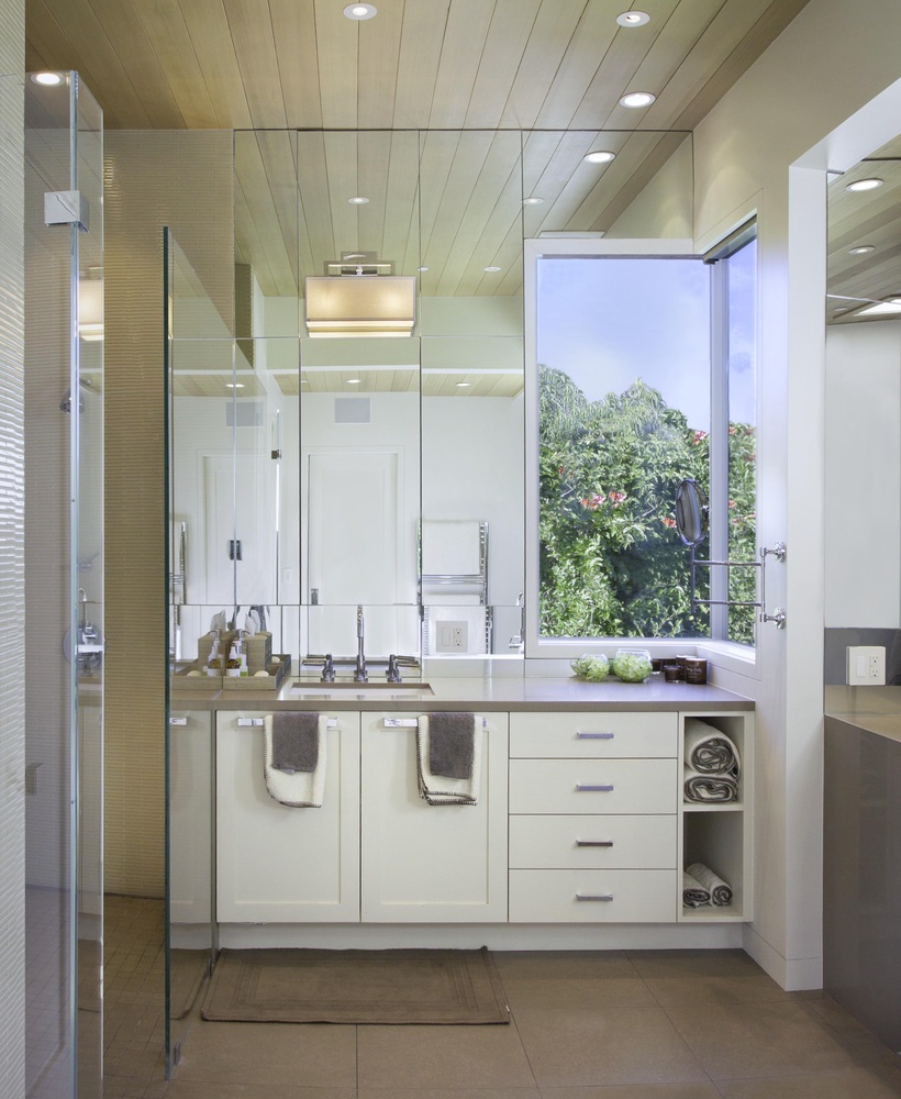 Bright modern vanity with dual sinks and natural light in Tiburon home by S.A. Baxter, Inc.