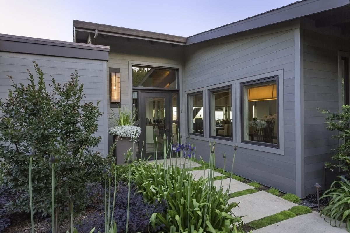 Concrete paver path leading to modern entry of Tiburon custom home by S.A. Baxter, Inc.