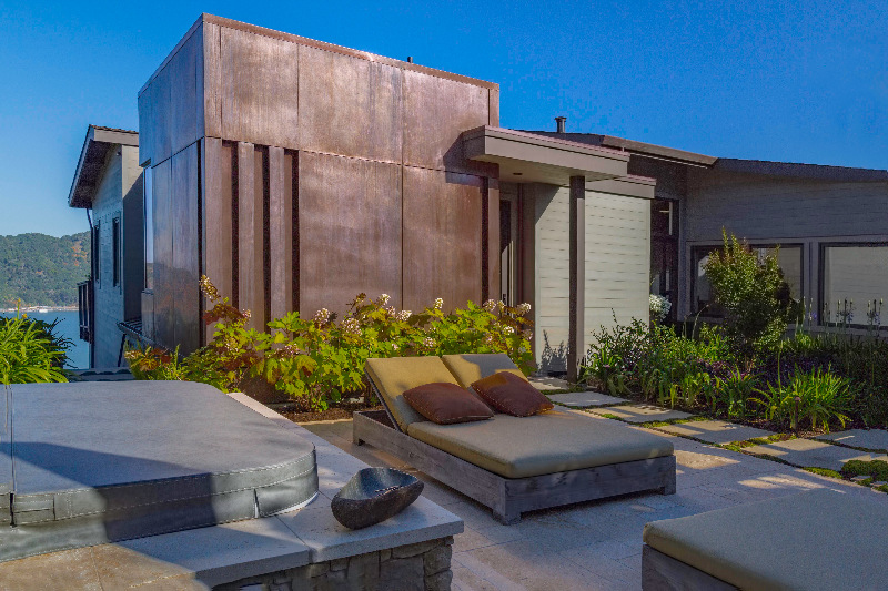 Custom home with copper architectural feature and lounge area overlooking the bay in Tiburon by S.A. Baxter, Inc.