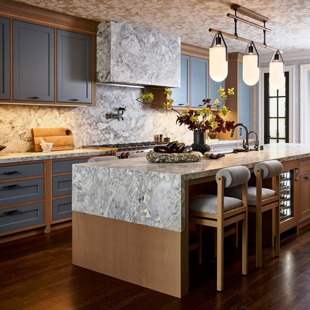 Luxury kitchen design blending soft blue cabinetry and statement lighting in Tiburon custom home by S.A. Baxter, Inc.
