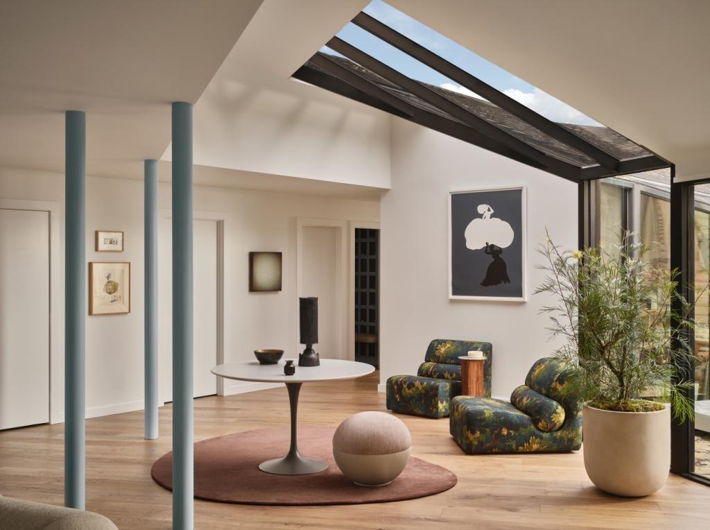 Lounge area under glass ceiling with modern decor in custom Marin County home by S.A. Baxter, Inc.