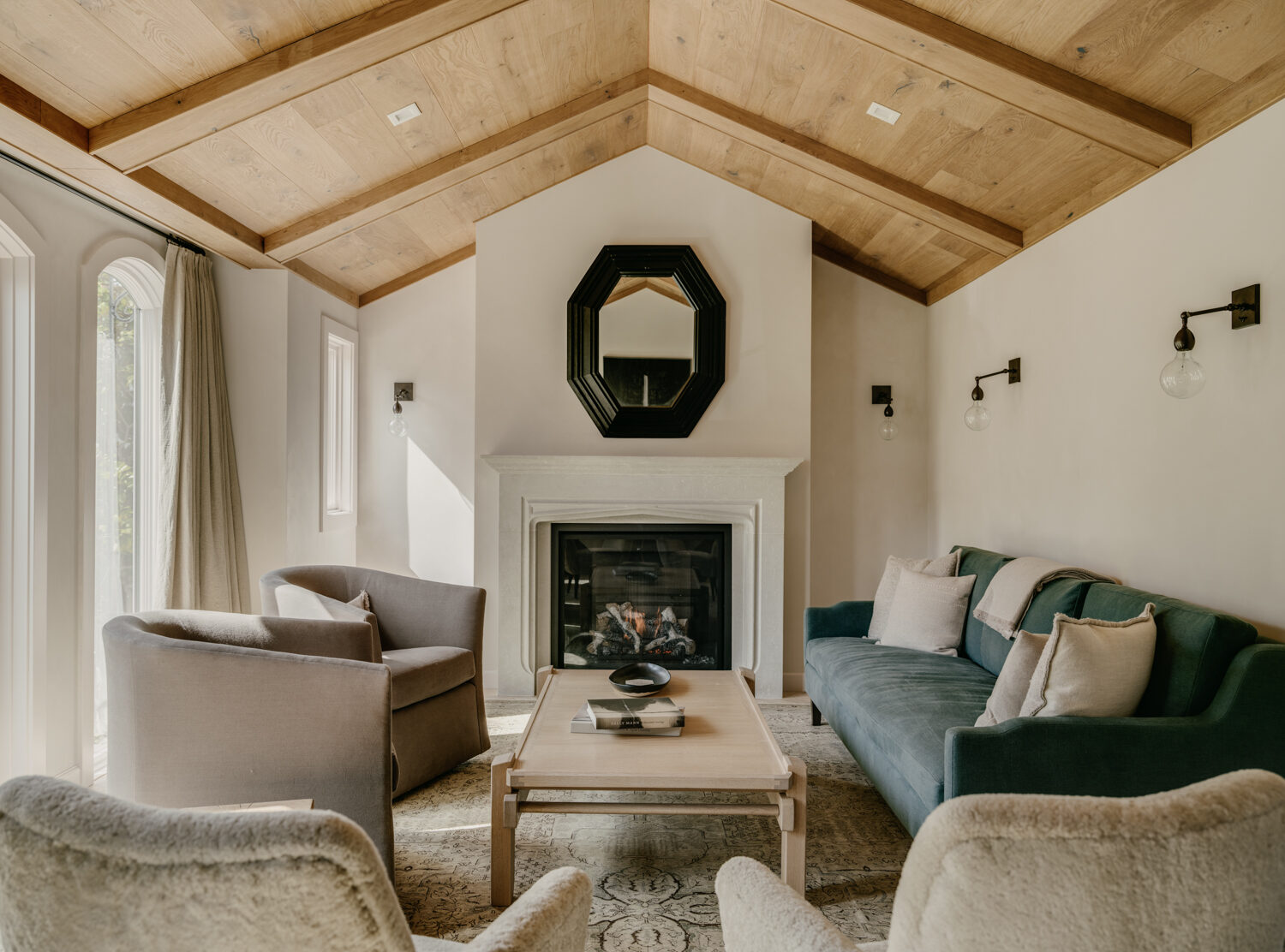 Cozy formal living room with fireplace and vaulted wood ceiling by S.A. Baxter, Inc. in Marina District custom home