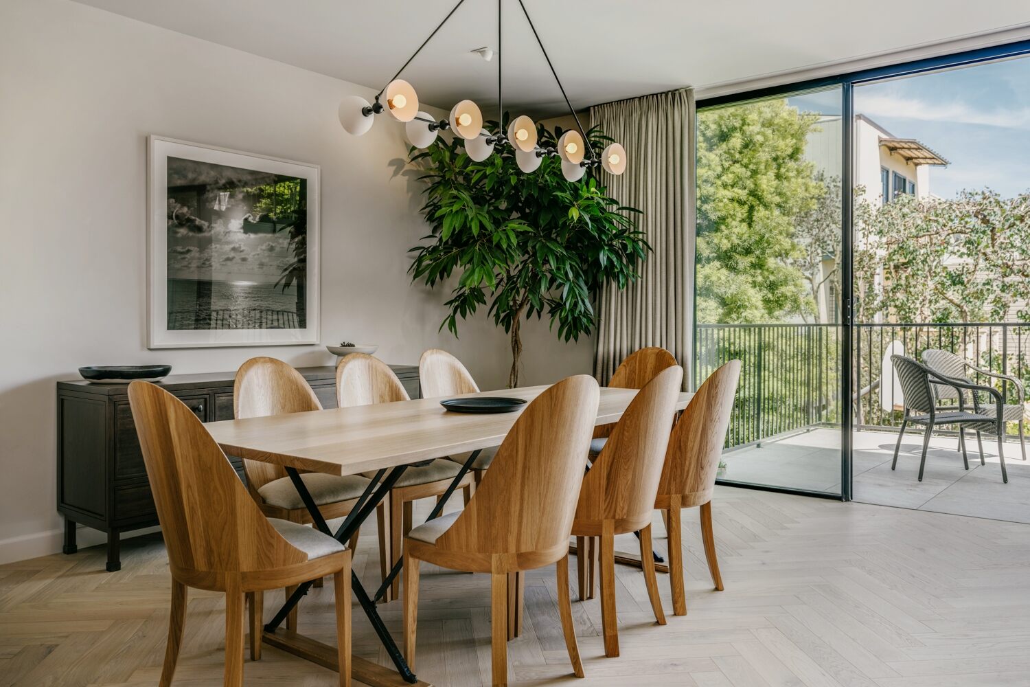 Dining room with wood table and sculptural chandelier in Marina District custom home by S.A. Baxter, Inc. Dining room with wood table and sculptural chandelier in Marina District custom home by S.A. Baxter, Inc.