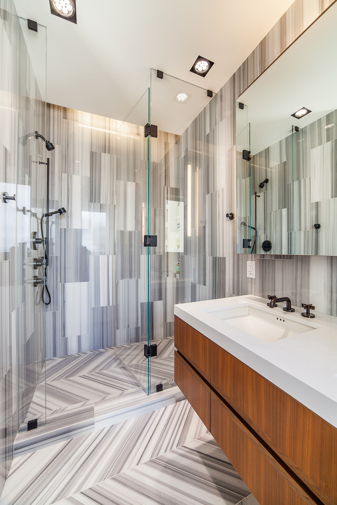 Contemporary bathroom with glass shower and striped tile in Nob Hill custom home by S.A. Baxter, Inc.